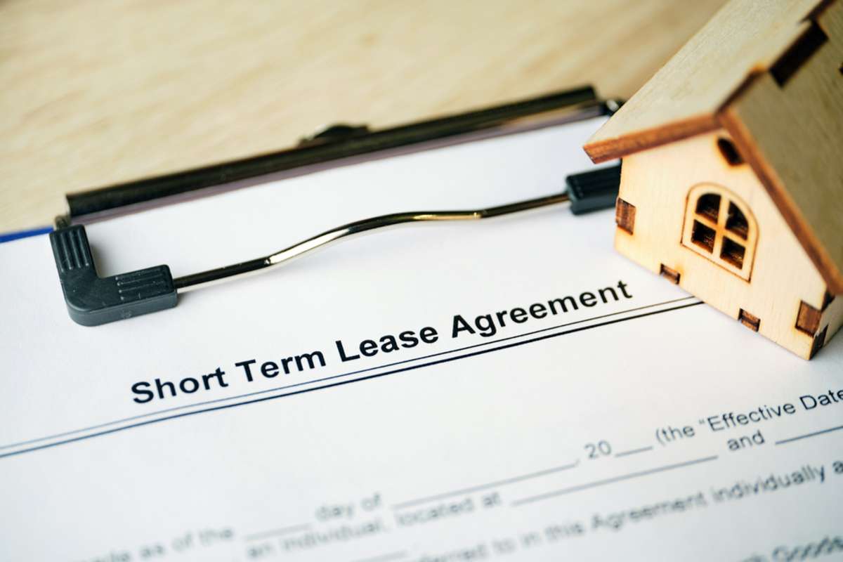 Legal document Short Term Lease Agreement on paper with pen